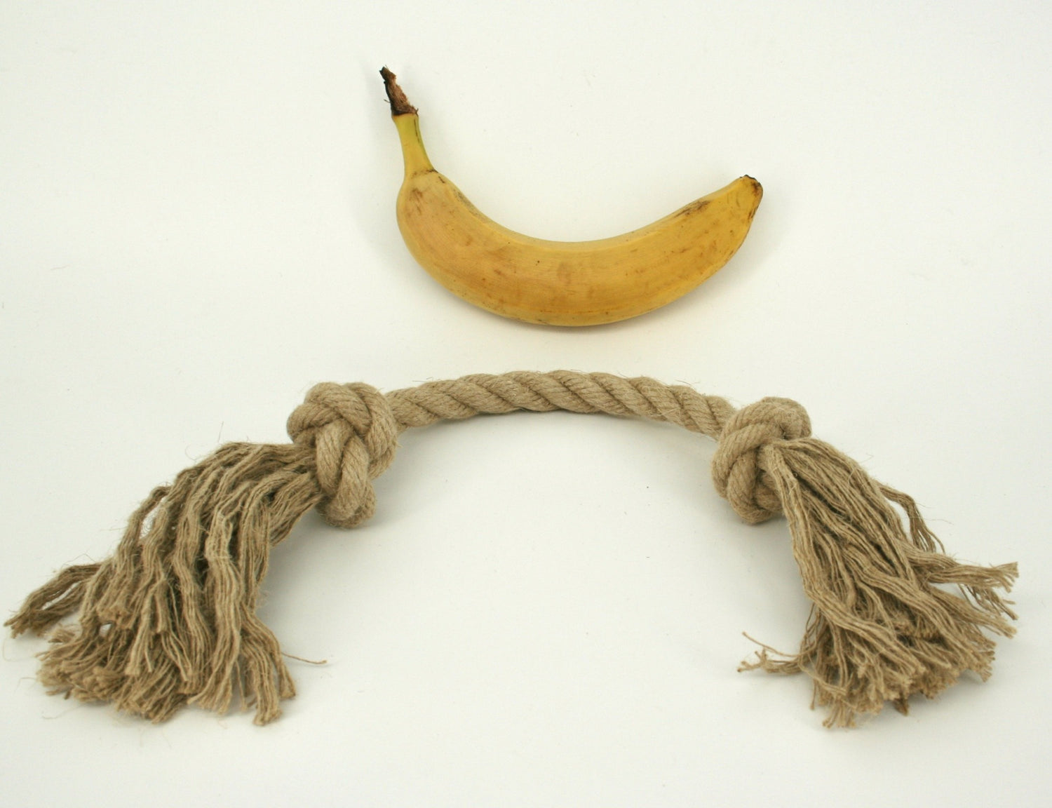 Medium simple hemp rope dog toy banana for scale
