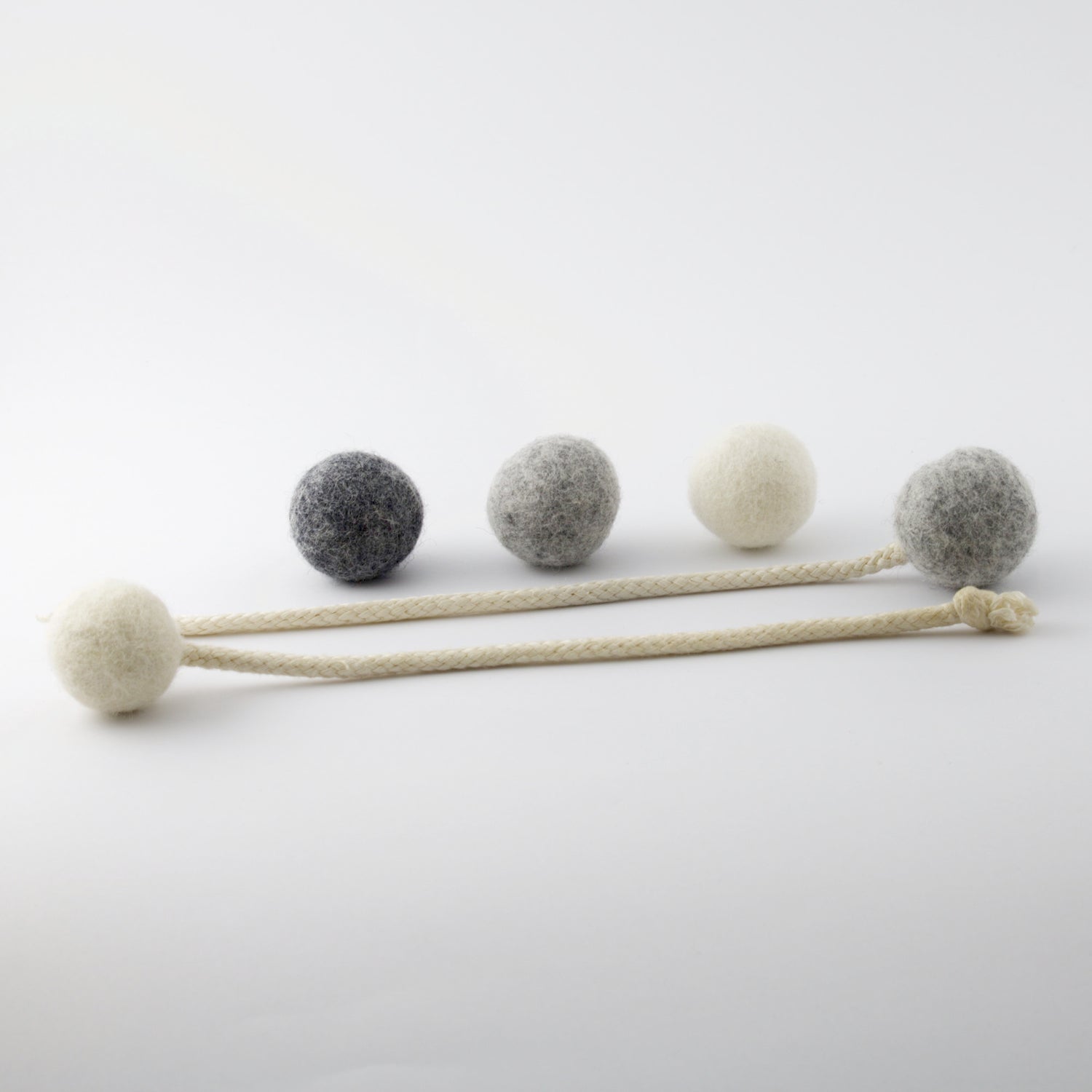 3 wool balls for cats and 2 balls with tails